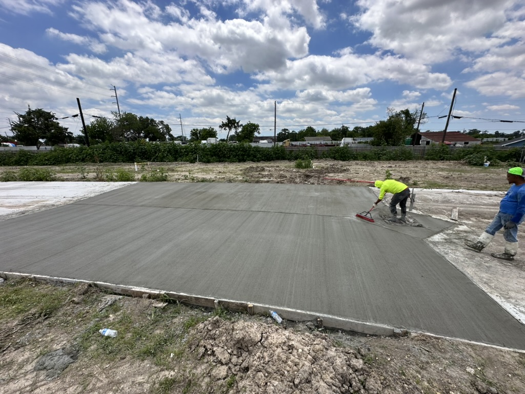 Fresh concrete slab being finished