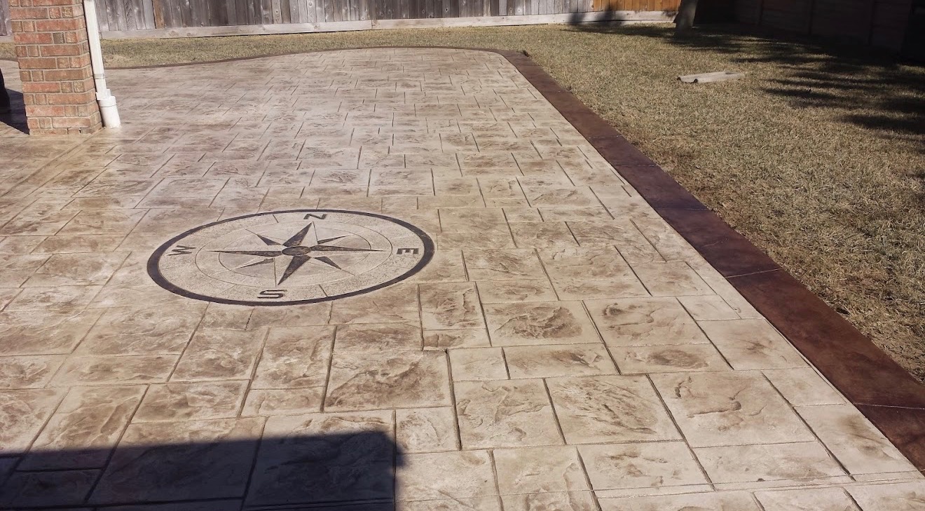 Decorative stamped concrete patio with compass design