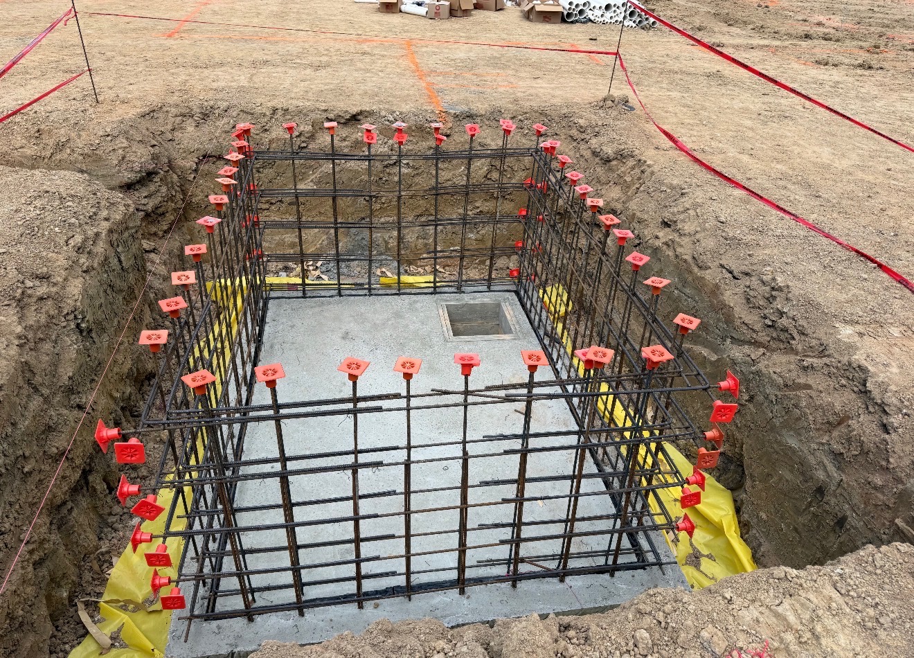 Reinforced concrete pit with rebar cage