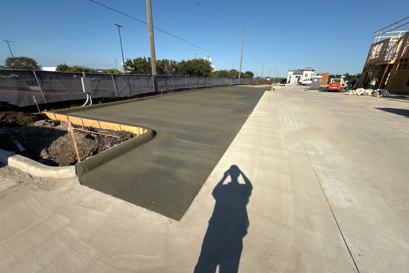 New concrete driveway and curb approach