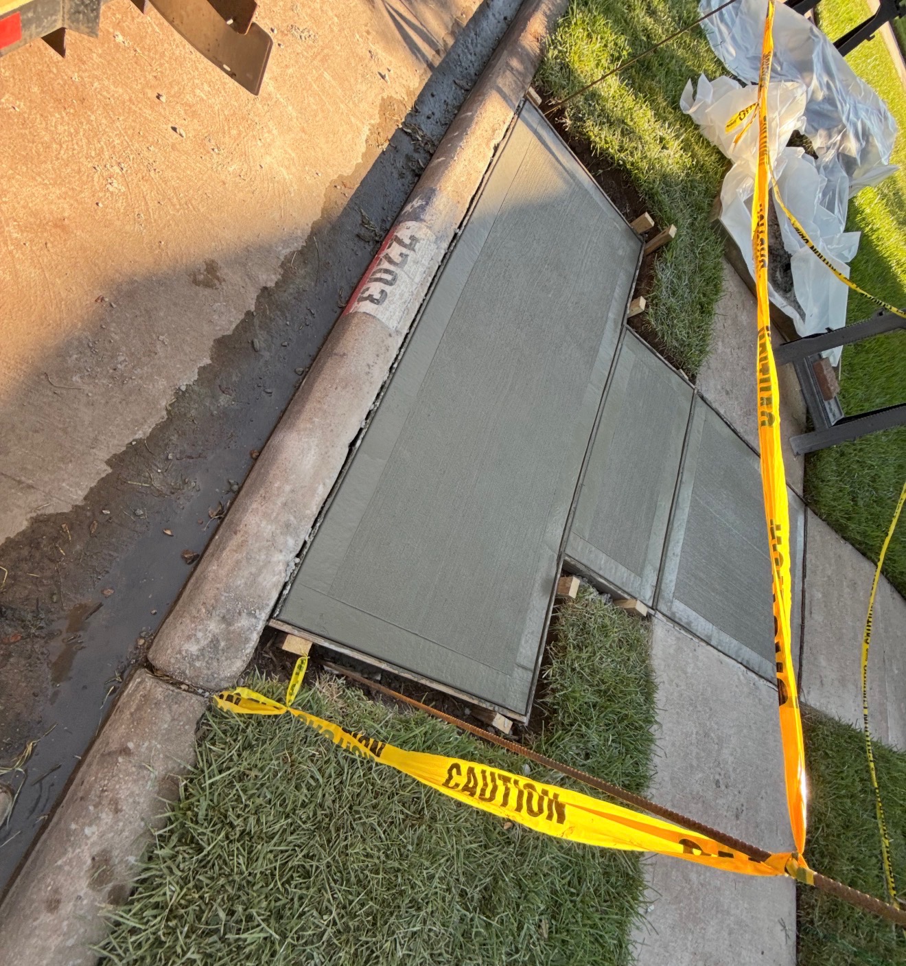 Fresh sidewalk panels near curb